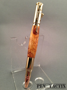 Bolt action pen in orange dyed cherry wood and gold accents